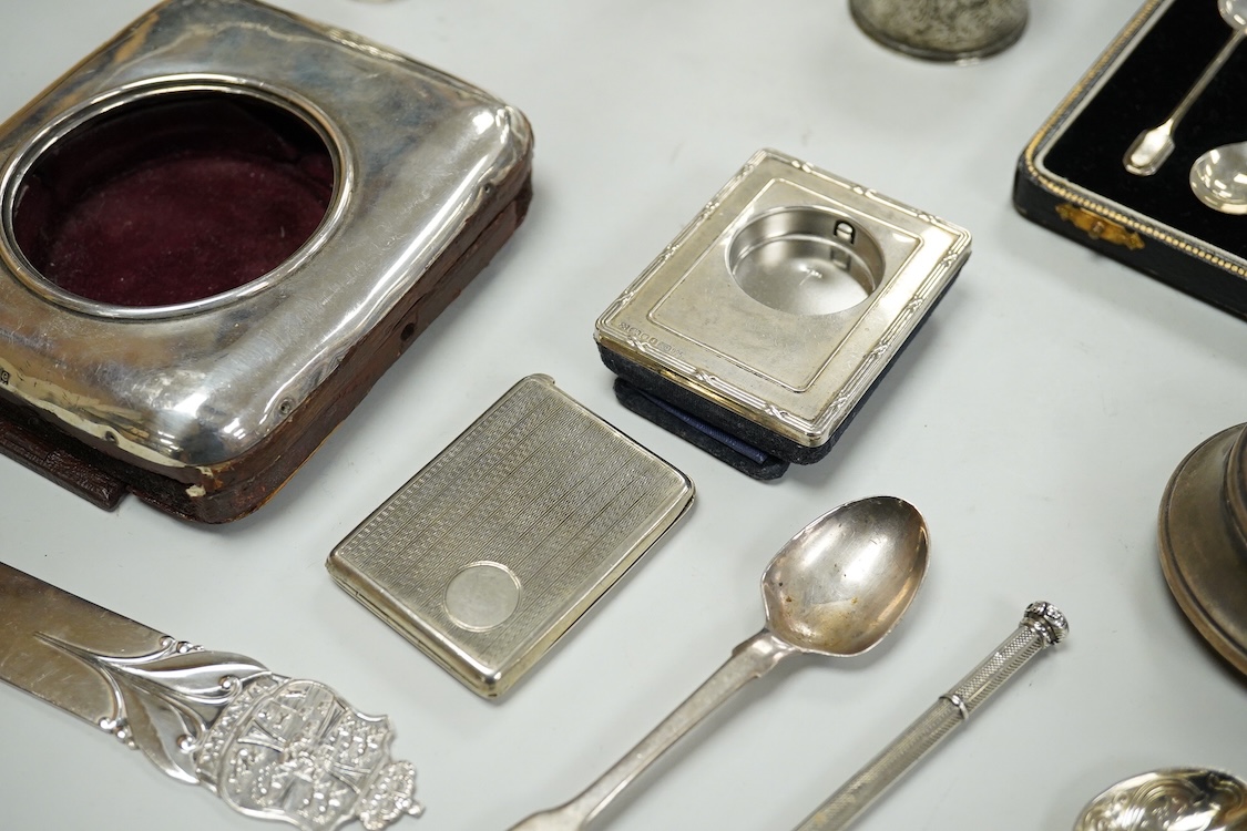 A collection of assorted small silver, including set of six 1930's coffee spoons, a mounted travelling pocket watch case, Victorian pepperette, mounted glass dwarf candlestick, enamelled powder box, Georgian stilton scoo